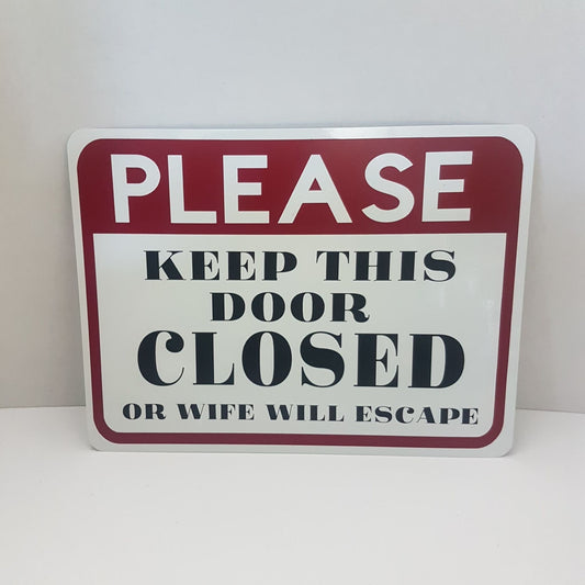 please keep this door closed - or wife will escape - sign